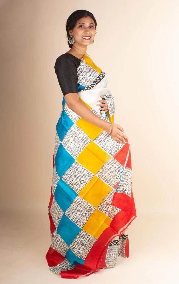 Yellow and red block print all over the saree on cream background
