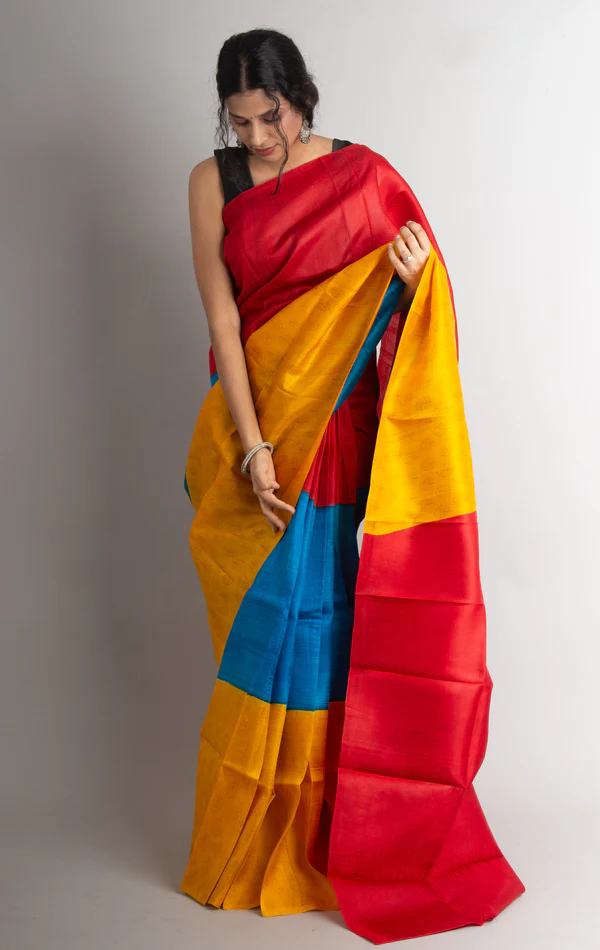 Saree Is In Yellow, Blue And Red Combination