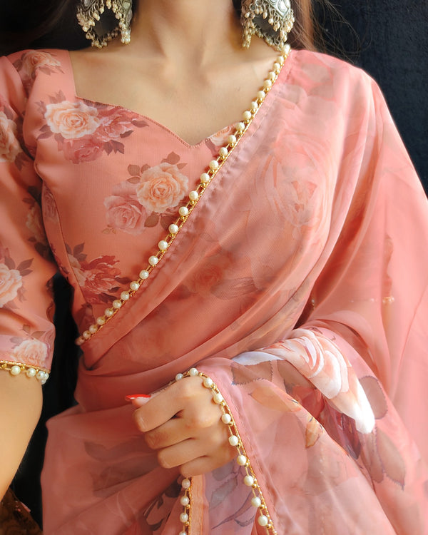 Orange georgette printed saree with Pearl lace border