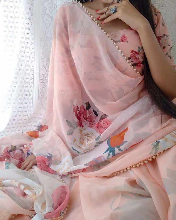 Peach georgette printed saree with Pearl lace border